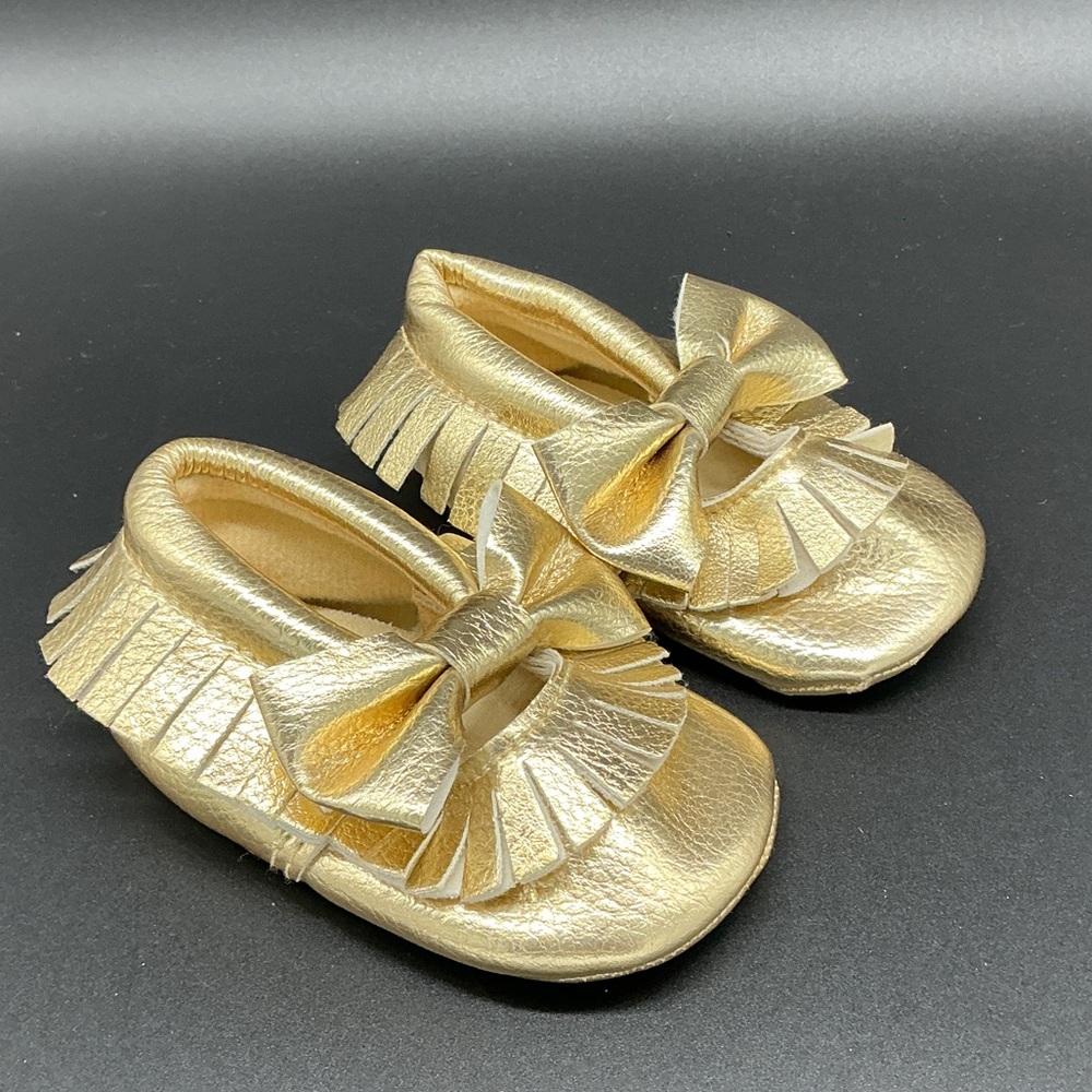 Romirus Metallic Gold Bow Fringe Moccasins